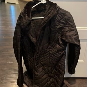 The North Face, women’s long reversible down jacket.